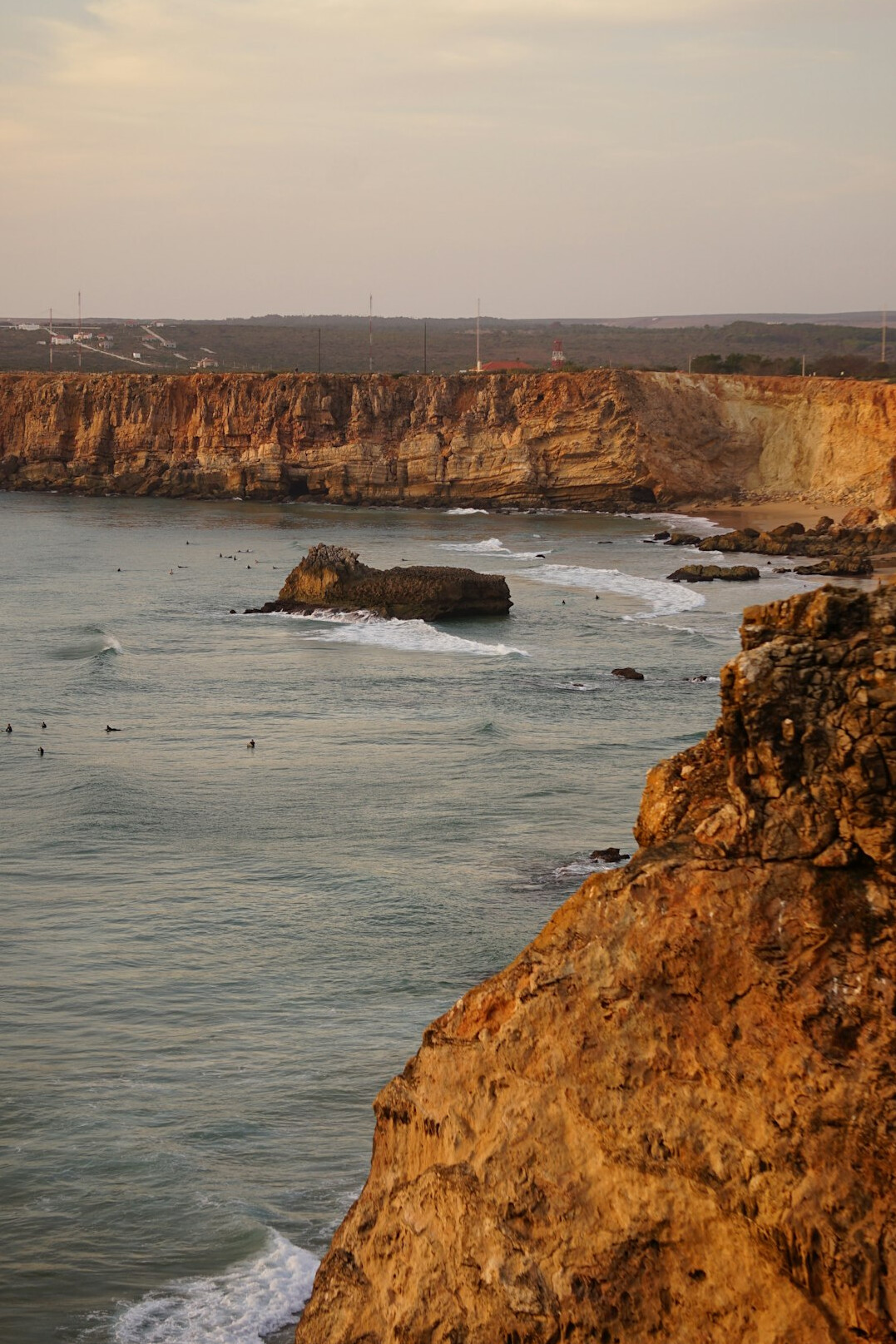 Aerial view of the Portuguese coastline with waves meeting rocky cliffs