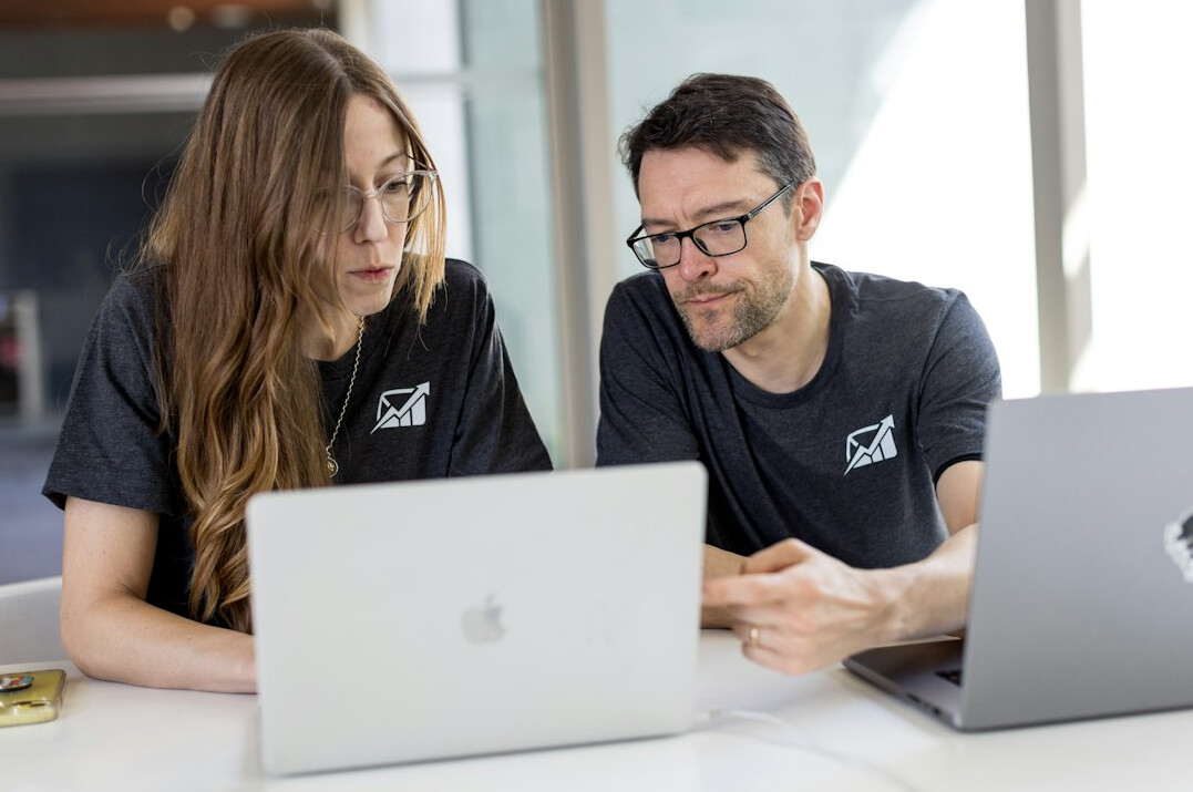 team collaborating on laptop